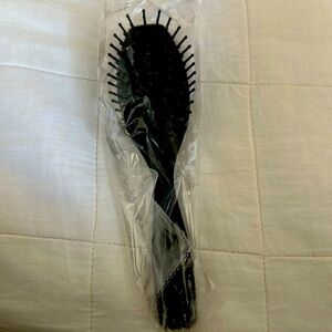 Brand new hairbrush.  Great size.  Portable & lightweight with quality bristles.